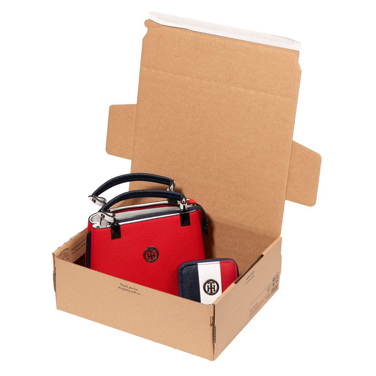 An open SP343 mailbox packaging with a handbag and purse stored in the box. This box is mainly used for ecommerce packaging. Image shows the Lil Packaging unique 'peel 'n' seal' sealing strip. Manufactured in the UK by Lil Packaging