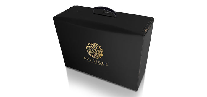 High end luxury packaging for premium brands. Gold embossed on silk black, with cotton carry handle and unique fifth corner design. Manufactured in the UK