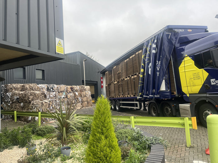 Photograph outside Lil Packaging of recycling bundles