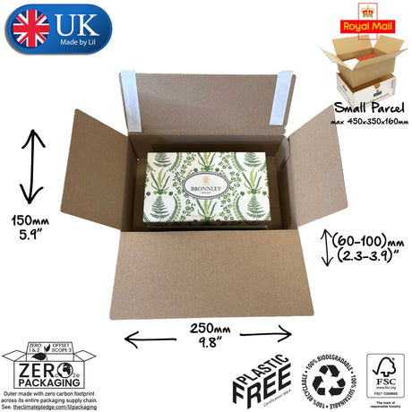 Cardboard box with a product inside, labeled for size and packaging details, featuring UK and Royal Mail logos.